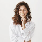 Cute happy european woman with curly hair