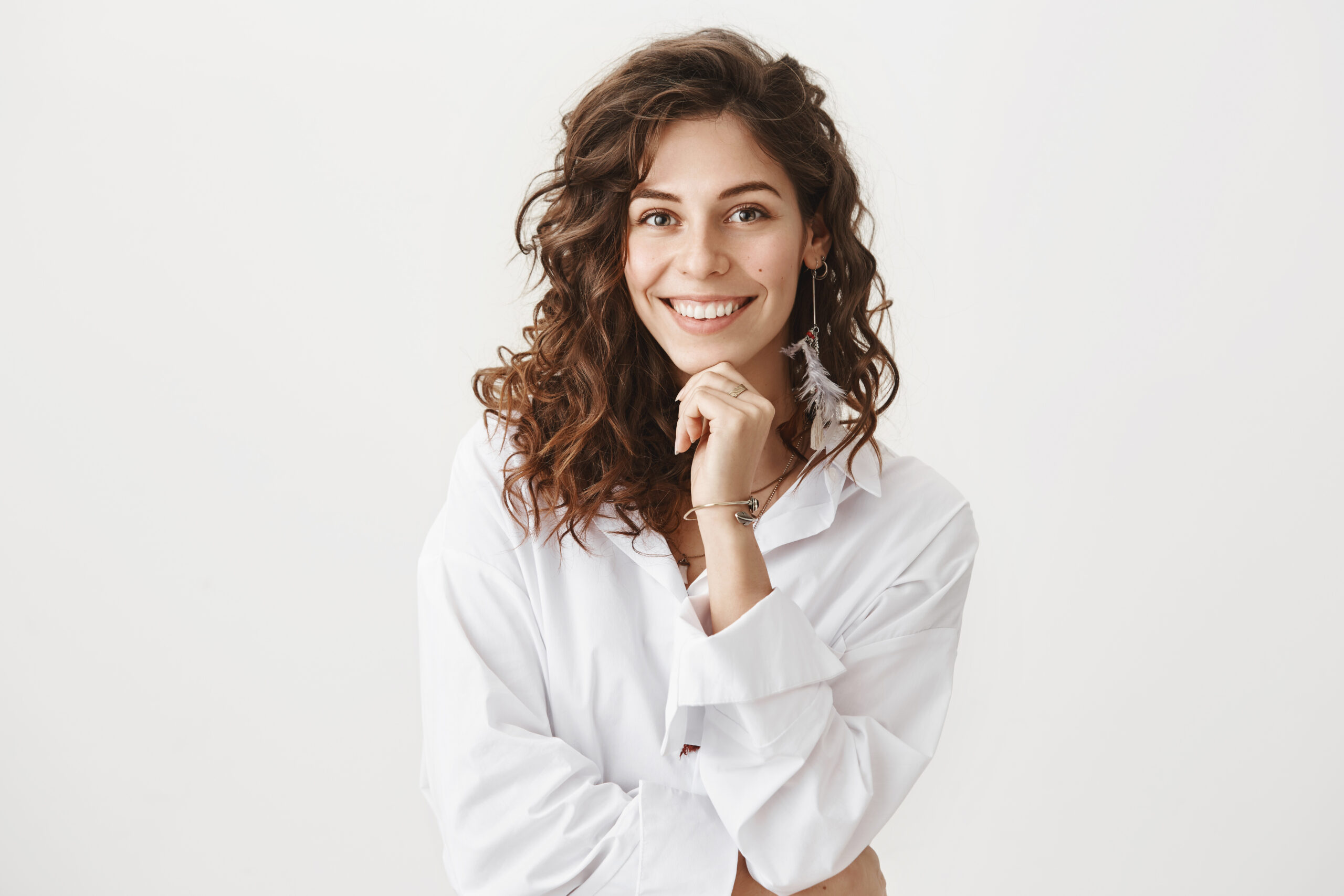 Cute happy european woman with curly hair